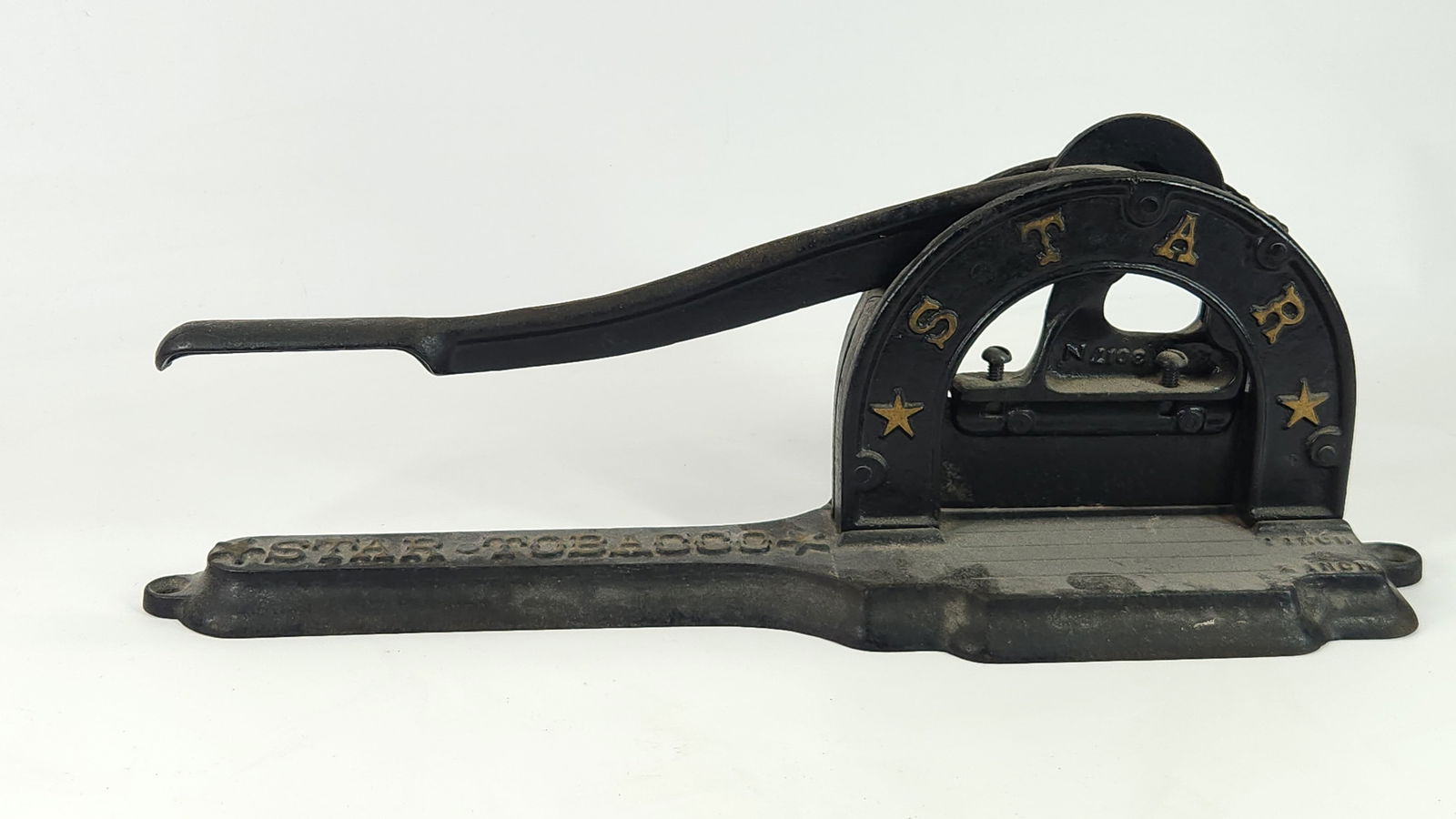 ANTIQUE CAST IRON STAR TOBACCO CUTTER: REMAINS IN GOOD USED CONDITION, SHOWING SOME TYPICAL WEAR. HAS BEEN REPAINTED. DUSTY, NEEDS CLEANED.
