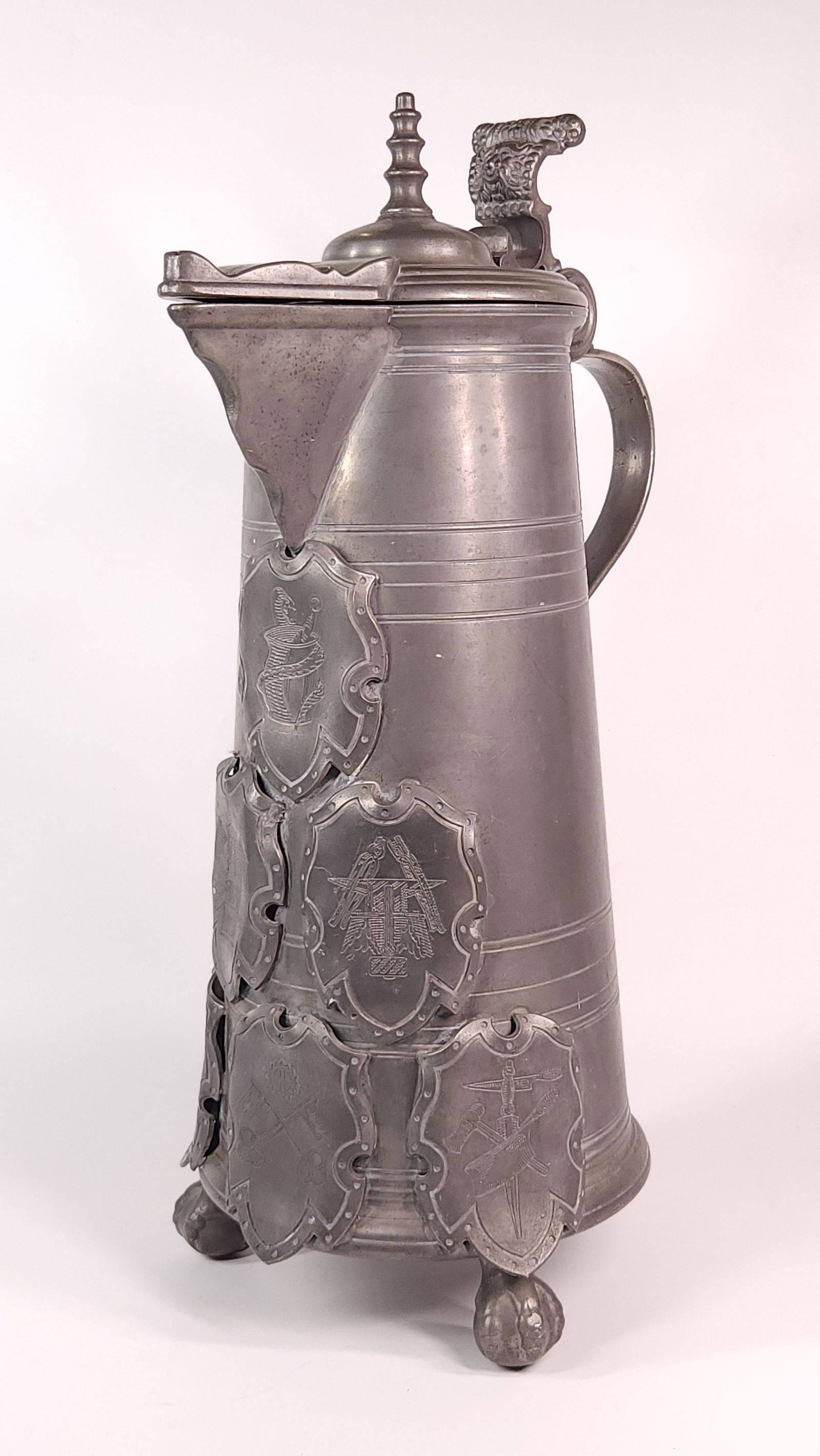 ANTIQUE PEWTER MASONIC IMAGES ON SHIELDS WATER PITCHER: REMAINS IN GOOD CONDITION, SHOWING SOME TYPICAL WEAR CONSISTENT WITH AGE AND USE.