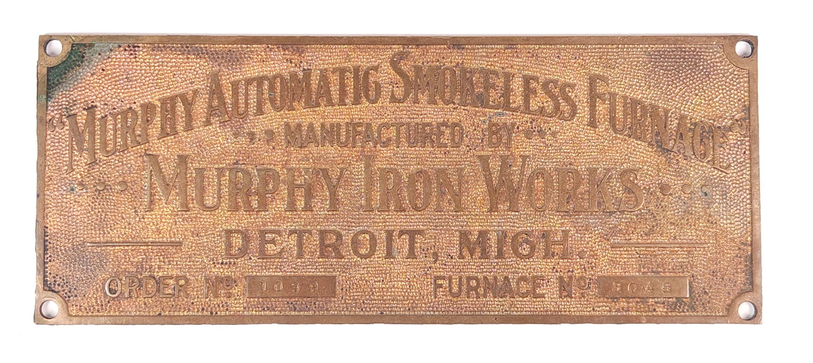 MURPHY AUTOMATIC SMOKELESS FURNACE CAST METAL EMBLEM: REMAINS IN GOOD CONDITION, SHOWING SOME TYPICAL WEAR.