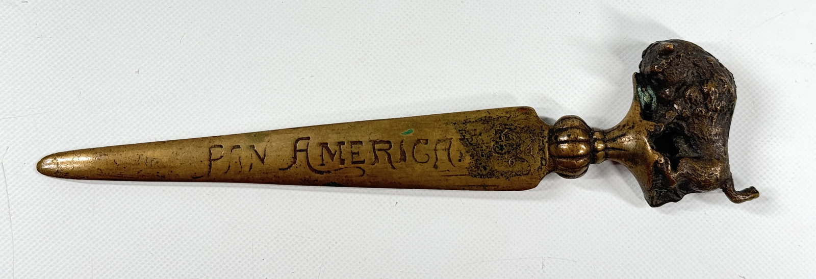 1901 PAN AMERICA BUFFALO LETTER OPENER: REMAINS IN GOOD CONDITION, SHOWING SOME TYPICAL WEAR.