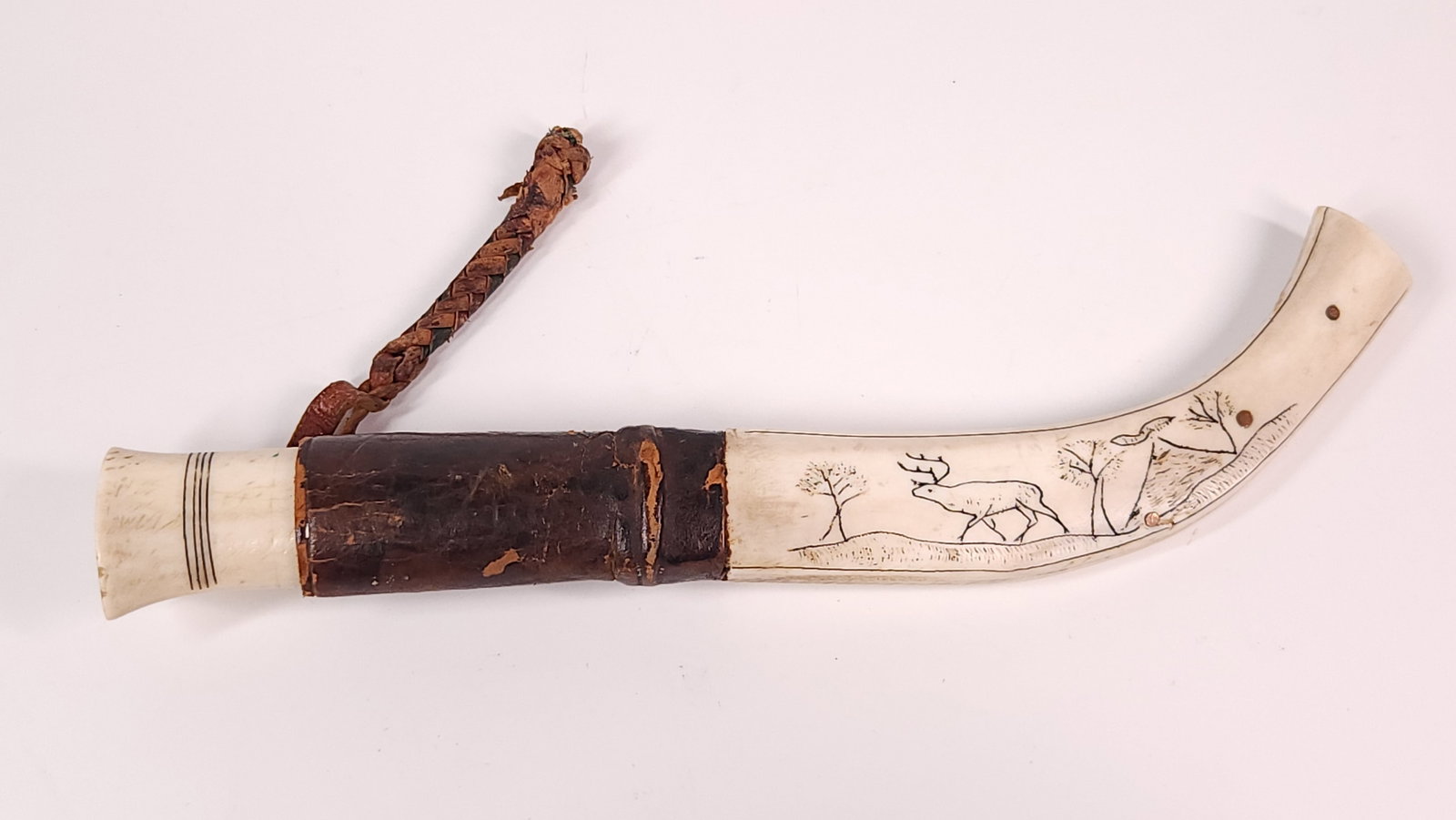 INUIT ESKIMO CARVED BONE HUNTING KNIFE: REMAINS IN GOOD CONDITION, SHOWING SOME TYPICAL WEAR.