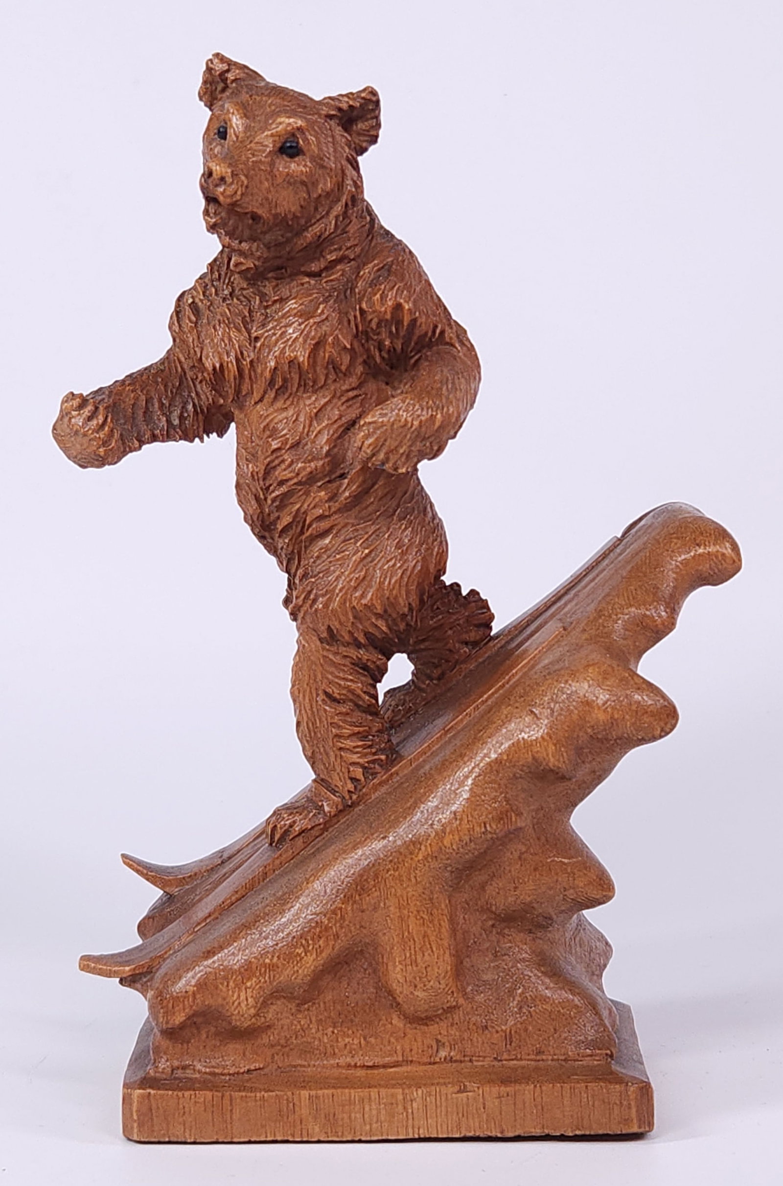 BLACK FOREST WOOD CARVED BEAR SKIING ON MOUNTAIN: REMAINS IN GOOD CONDITION, SHOWING SOME TYPICAL WEAR CONSISTENT WITH USE AND AGE.
