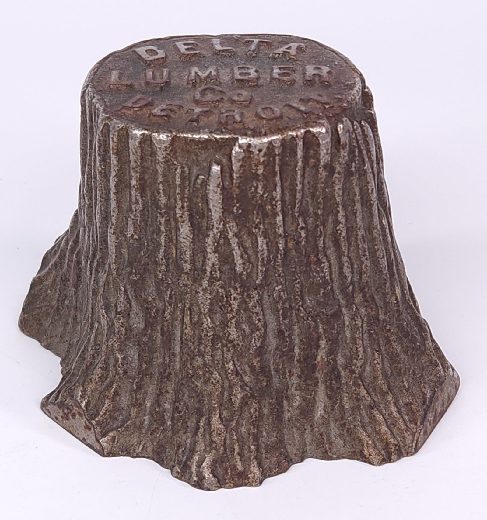 ANTIQUE DELTA LUMBER CO DETROIT ADVERTISING STUMP: REMAINS IN FAIR TO GOOD CONDITION, SHOWING TYPICAL WEAR CONSISTENT WITH AGE AND USE.