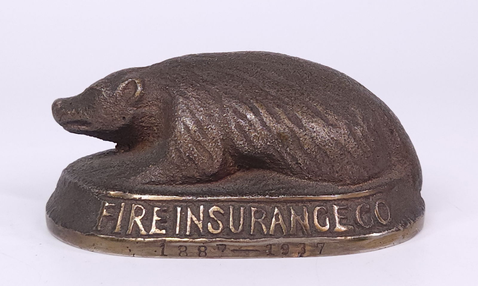 1937 THE BADGER MUTUAL FIRE INS. CO. ADVERTISING PAPERWEIGHT: REMAINS IN FAIR TO GOOD CONDITION, SHOWING TYPICAL WEAR CONSISTENT WITH AGE AND USE.