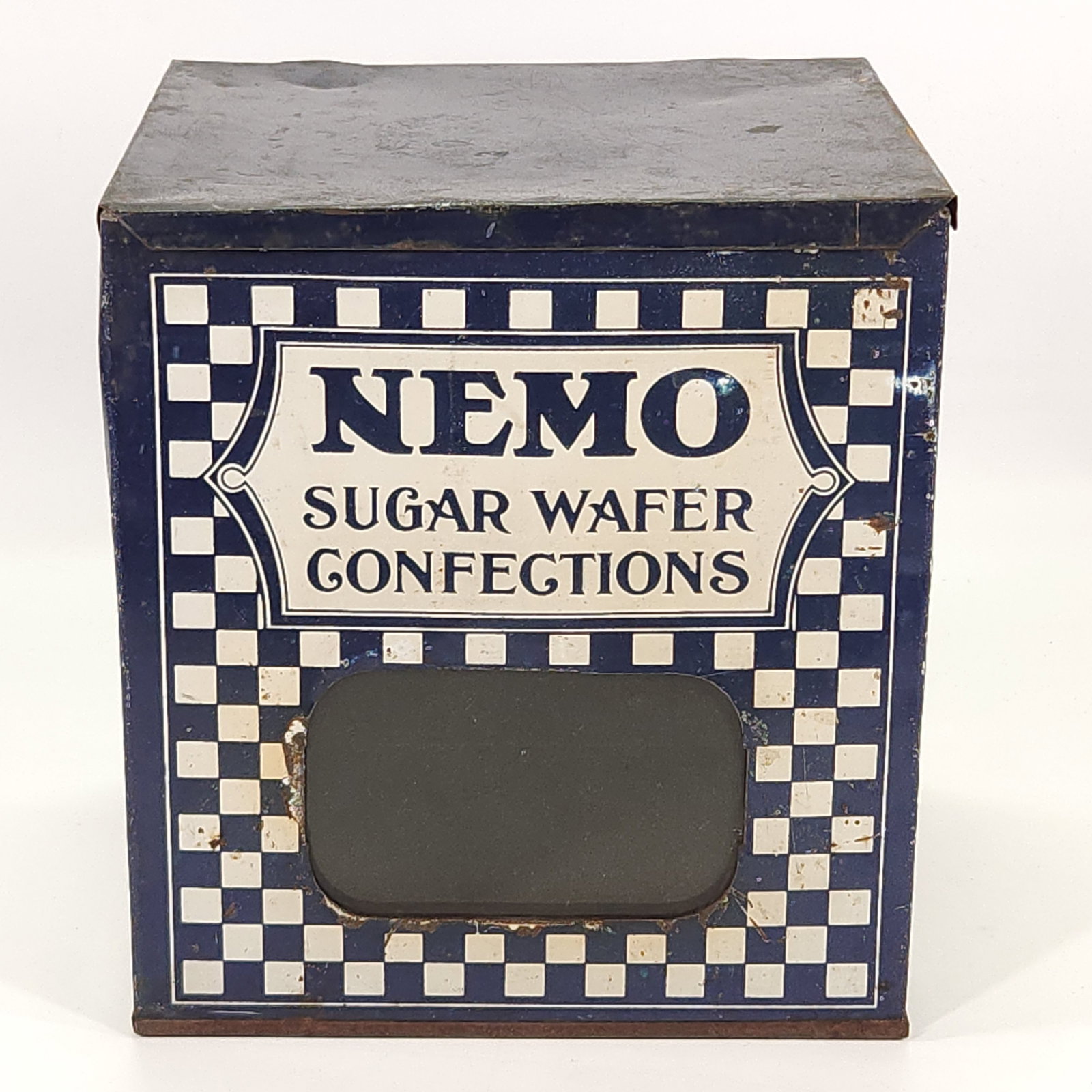 COUNTRY STORE NEMO SUGAR WAFER CONFECTIONS TIN: REMAINS IN FAIR TO GOOD CONDITION, SHOWING TYPICAL WEAR CONSISTENT WITH AGE AND USE.