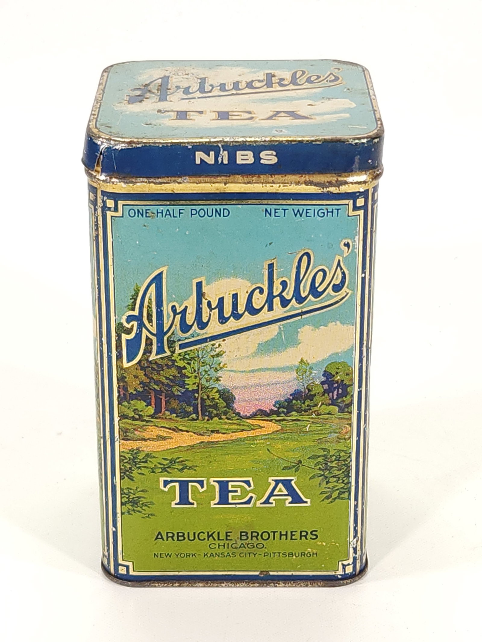 ARBUCKLE BROTHERS TEA TIN 1/2 POUND: REMAINS IN FAIR TO GOOD CONDITION, SHOWING TYPICAL WEAR CONSISTENT WITH AGE AND USE.