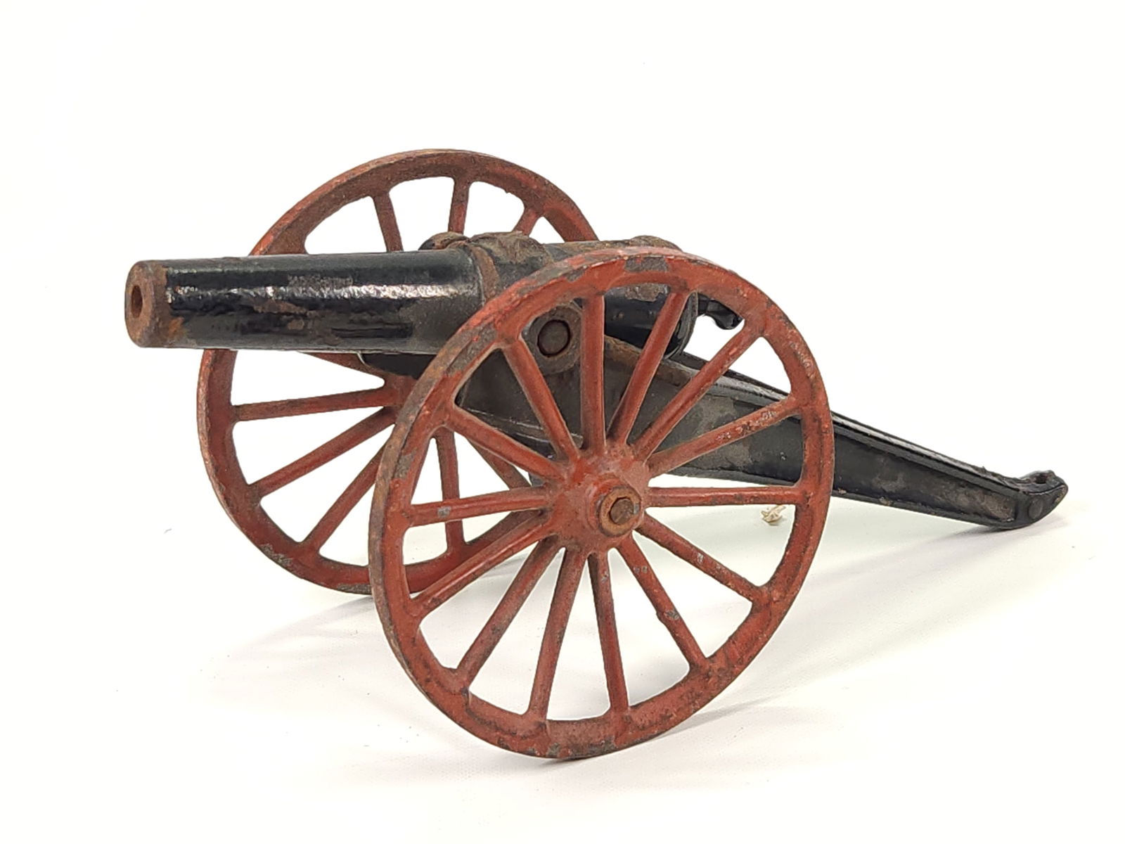 ANTIQUE CAST IRON CANNON: REMAINS IN FAIR TO GOOD CONDITION, SHOWING TYPICAL WEAR. PAINT LOSS IN SPOTS.