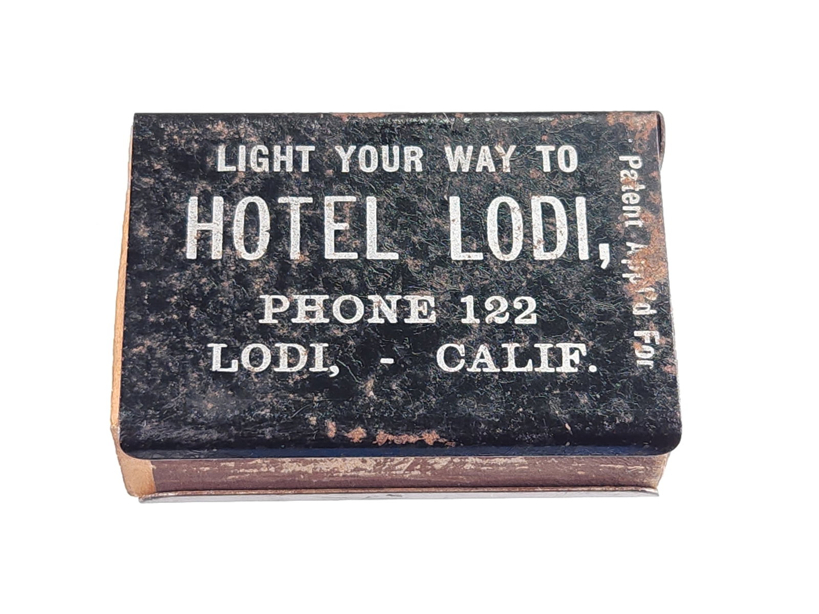 HOTEL LODI CALIFORNIA ADVERTISING MATCH SAFE: REMAINS IN FAIR CONDITION, SHOWING SOME TYPICAL WEAR.