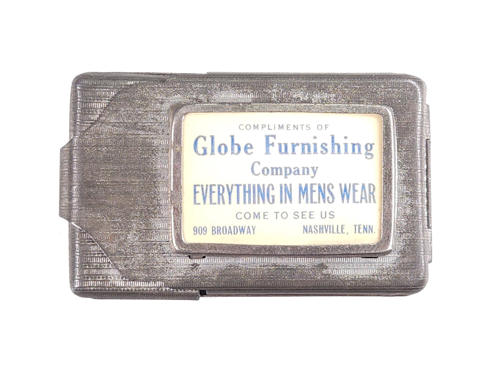 GLOBE FURNISHING MENS WEAR ADV. MATCH SAFE: REMAINS IN GOOD CONDITION, SHOWING SOME TYPICAL WEAR.