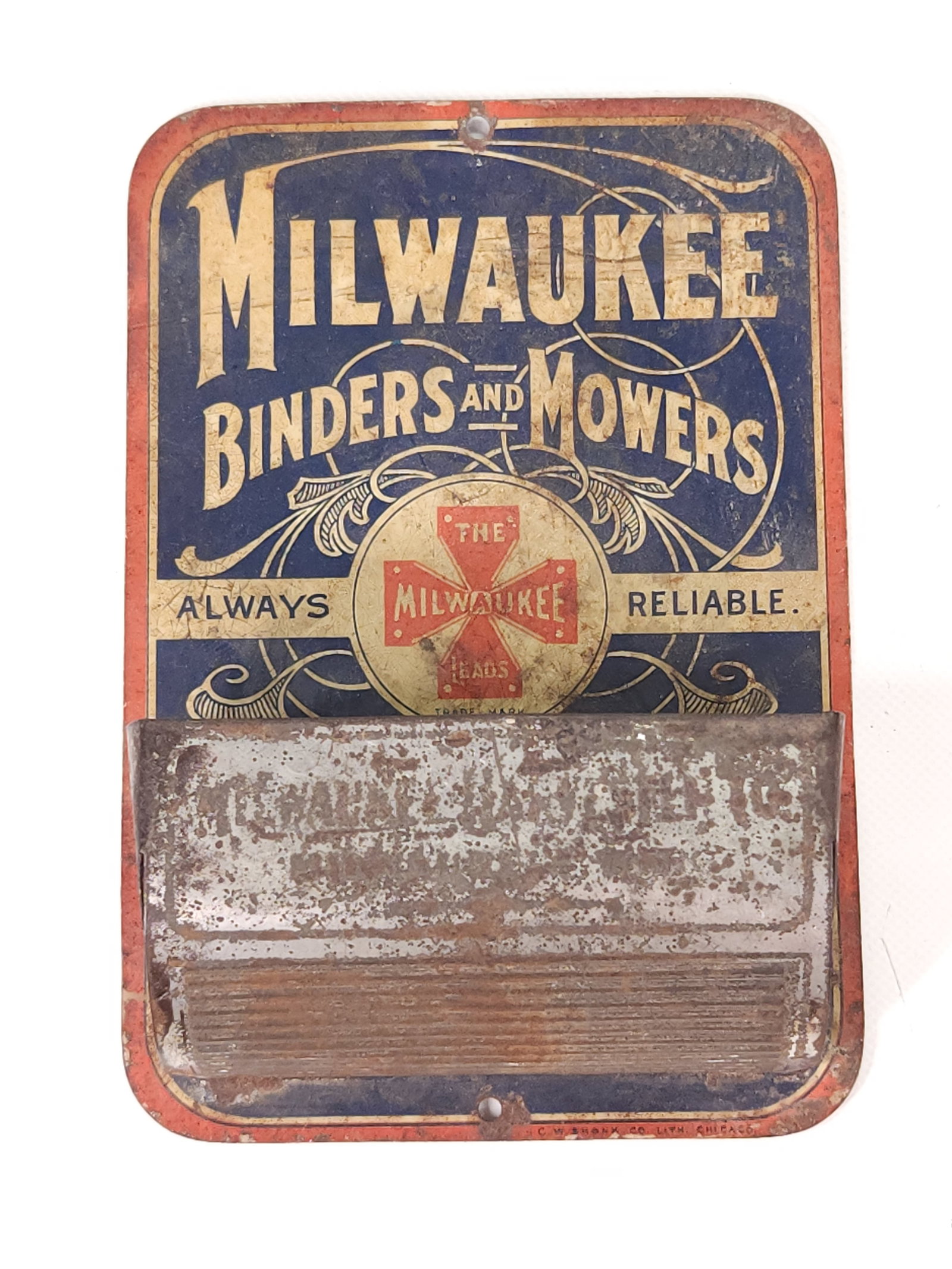 MILWAUKEE BINDERS & MOWERS ADVERTISING MATCH SAFE: REMAINS IN FAIR CONDITION, SHOWING WEAR THROUGHOUT.