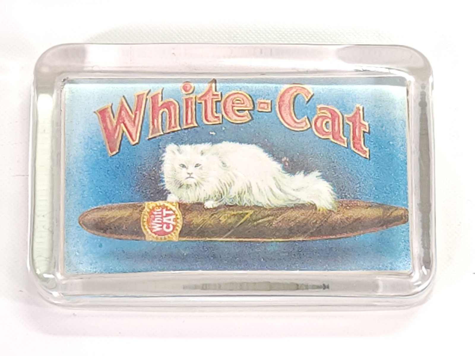 WHITE CAT GLASS ADVERTISING CIGAR PAPERWEIGHT: REMAINS IN GOOD CONDITION, SHOWING SOME TYPICAL WEAR.