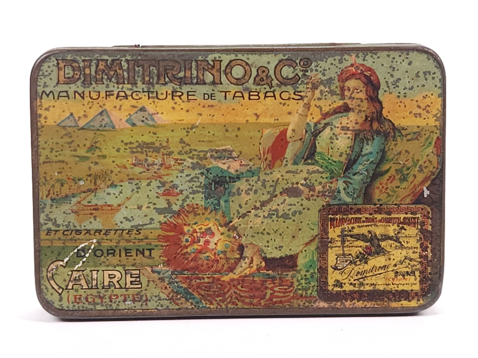 DIMITRINO & CO. EGYPTIAN CIGARETTE TOBACCO TIN: REMAINS IN FAIR CONDITION, SHOWING SOME TYPICAL WEAR.