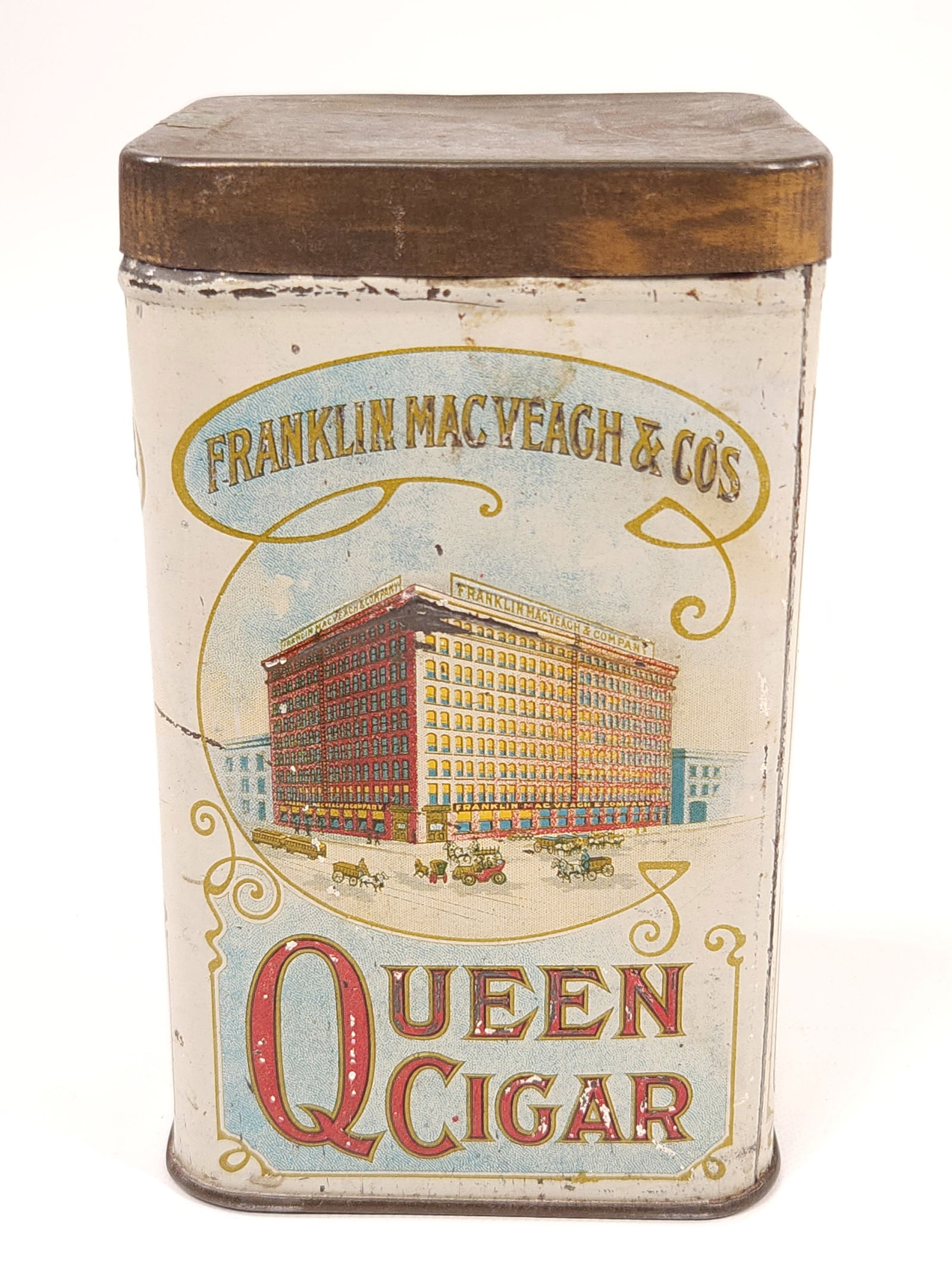 FRANKLIN MACVEAGH & SONS QUEEN CIGAR TIN: REMAINS IN GOOD CONDITION, SHOWING SOME TYPICAL WEAR.