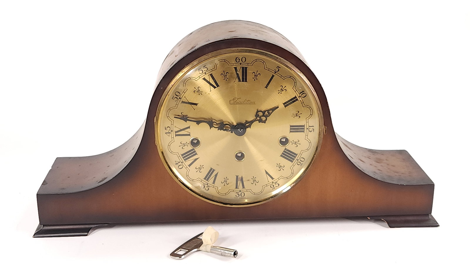 SEARS TRADITION MANTEL CLOCK W. GERMANY W/ CHIME: CLOCK REMAINS IN GOOD CONDITION WITH LIGHT GENERAL WEAR, MARK ON WOOD - LEFT SIDE, INCLUDES KEY APPROX. COMBINED DIMENSIONS: 9'' H x 5'' W x 18'' D