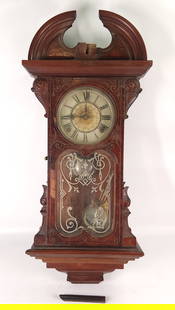 GILBERT VIENNA REGULATOR WALL CLOCK MOON PHASE: CLOCK REMAINS IN GOOD CONDITION WITH LIGHT GENERAL WEAR, MINOR VENEER LOSS, INCLUDED LOOSE WOOD PIECE, MOON PHASE ON FACE, MISSING FINIAL, GLASS SIDES, MIRRORED PENDULUM INCLUDED APPROX. COMBINED DIME