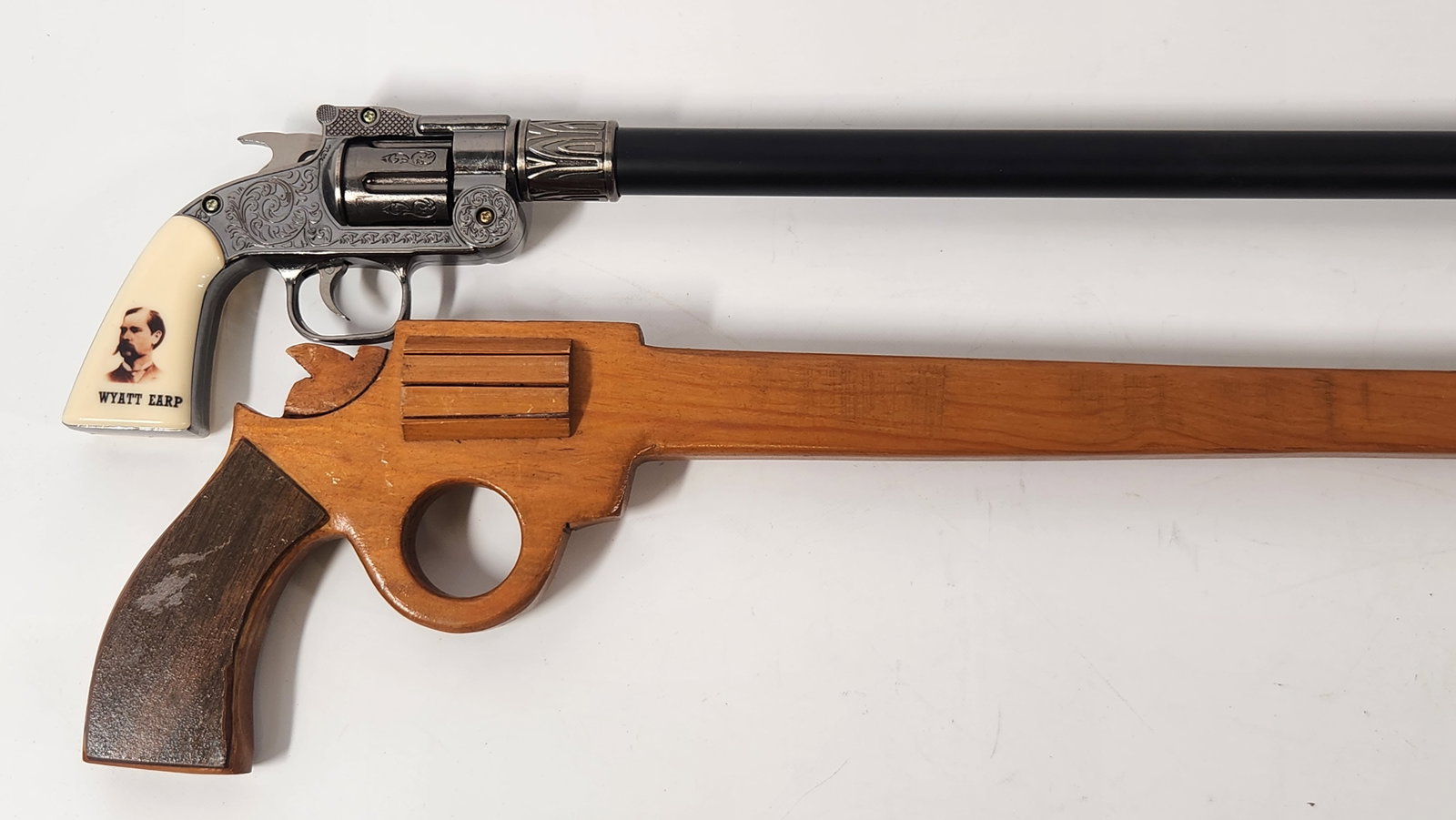 PAIR OF CANES, WYATT EARP & WOOD CARVED: PAIR OF CANES IN GOOD USED CONDITION