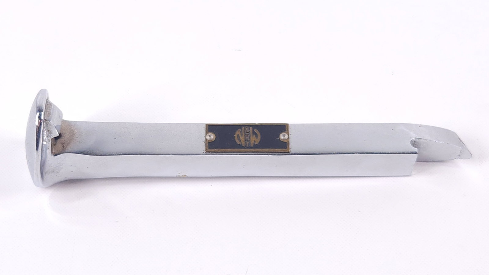 N&W RY. CHROME PLATED RAILROAD SPIKE BOTTLE OPENER: REMAINS IN GOOD CONDITION.