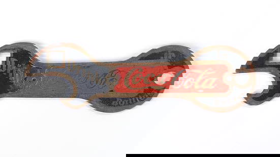 ANTIQUE ENAMELED COCA COLA BOTTLE OPENER: REMAINS IN GOOD CONDITION, SHOWING SOME TYPICAL WEAR.