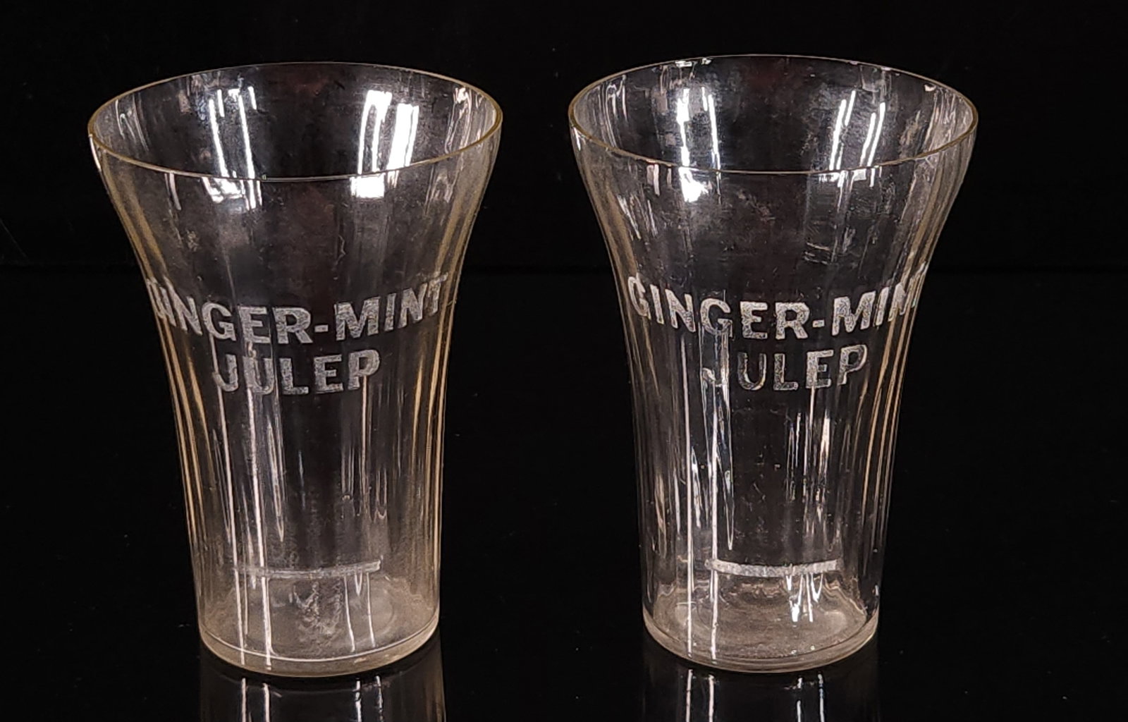 2) ANTIQUE GINGER MINT JULEP DRINKING GLASSES: BOTH REMAIN IN GOOD CONDITION, SHOWING LIGHT ROUGHNESS ON TOP EDGE. 2 AT 4 INCHES.