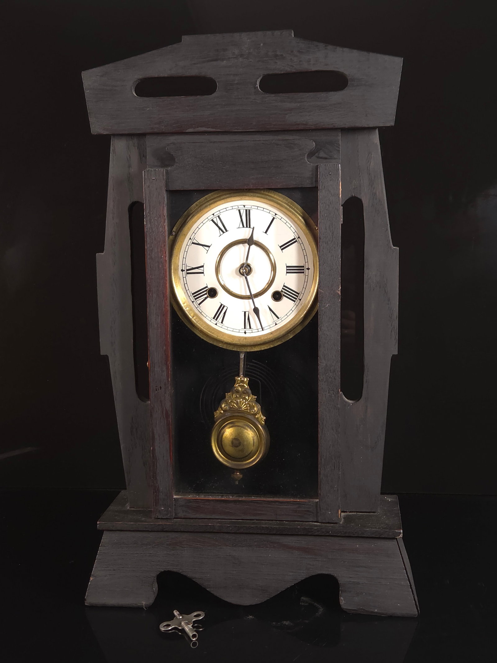 ARTS AND CRAFTS STYLE GINGERBREAD CLOCK: CUSTOM ANTIQUE CLOCK HAS BEEN REPAINTED. ONE OF THE SIDE COLUMNS IS LOOSE, NEEDS WORKS. 22 INCHES BY 13 INCHES.