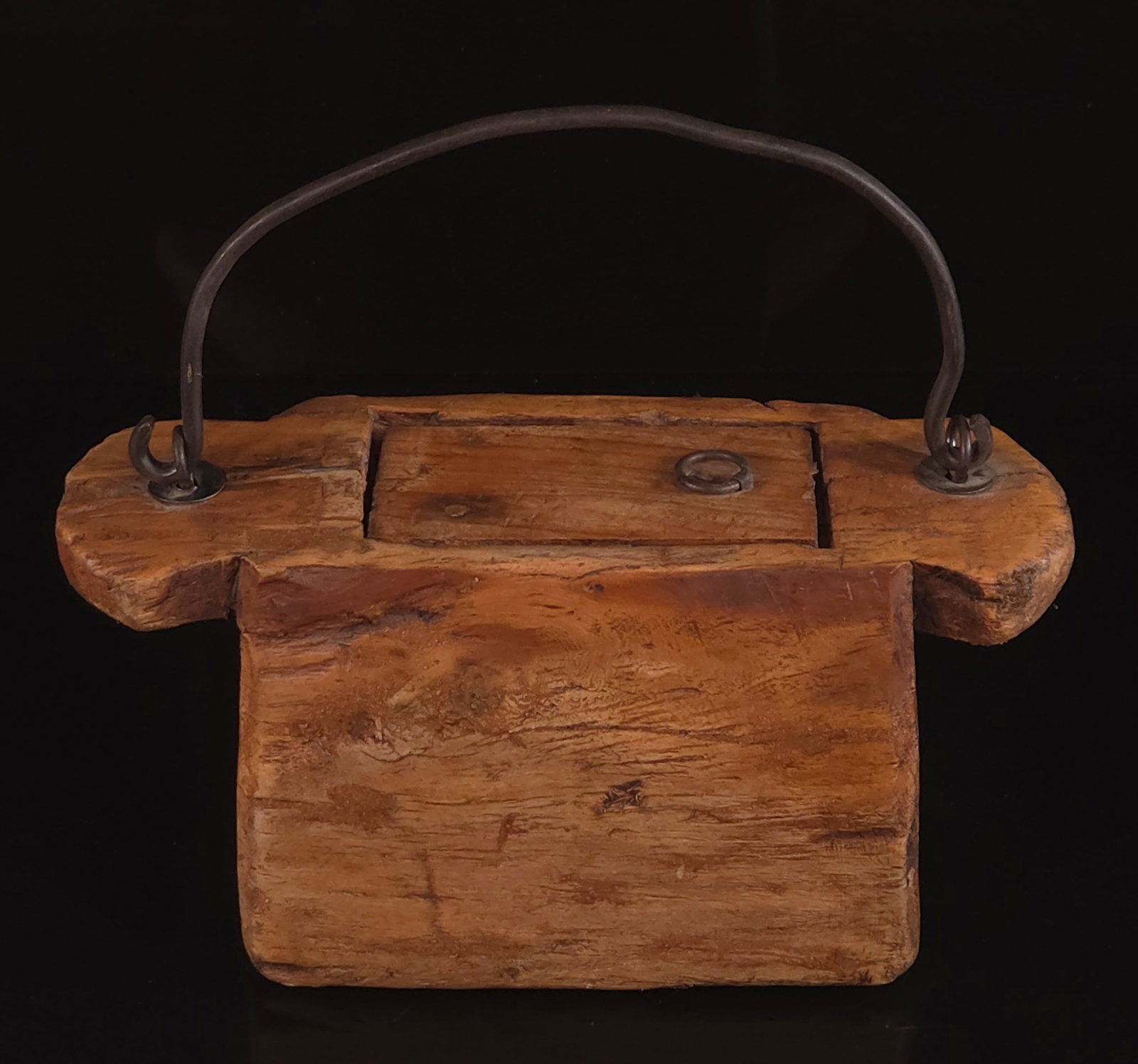 CARVED WOOD AND IRON LIDDED BOX: REMAINS IN GOOD CONDITION, SHOWING SOME TYPICAL WEAR. 11.5 INCHES BY 4 INCHES.