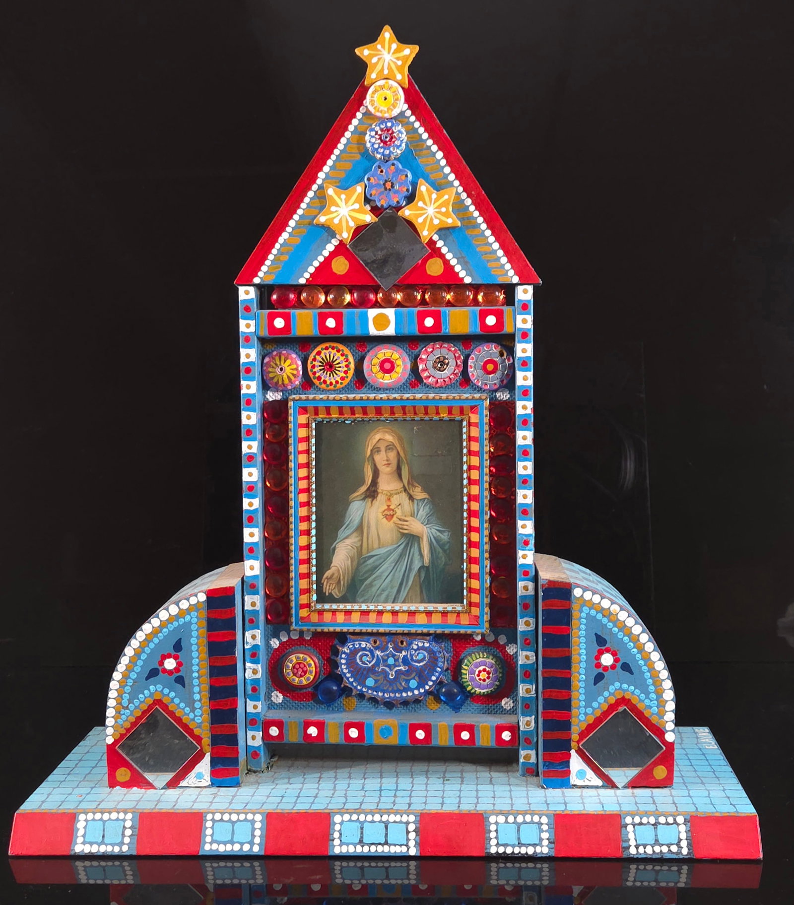 UNSIGNED RELIGIOUS OUTSIDER ART SHRINE MADONNA: REMAINS IN GOOD CONDITION, TOP RED TRIANGULAR PIECE IS SLIGHTLY LOOSE. 20 INCHES BY 17 3/4 INCHES.
