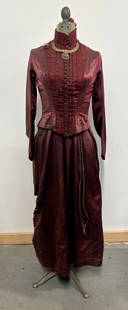 VICTORIAN ERA DRESS ON DRESS FORM: REMAINS IN GOOD CONDITION, SHOWING SOME TYPICAL WEAR. HAS A FEW TEARS AND STAINS AS SHOWN.
