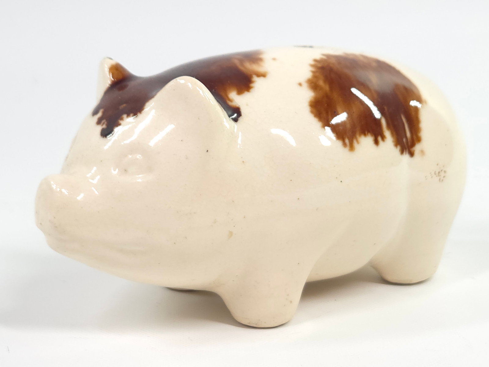 CERAMIC BROWN DECORATED PIG BANK: REMAINS IN GOOD CONDITION, NO CHIPS OR CRACKS.