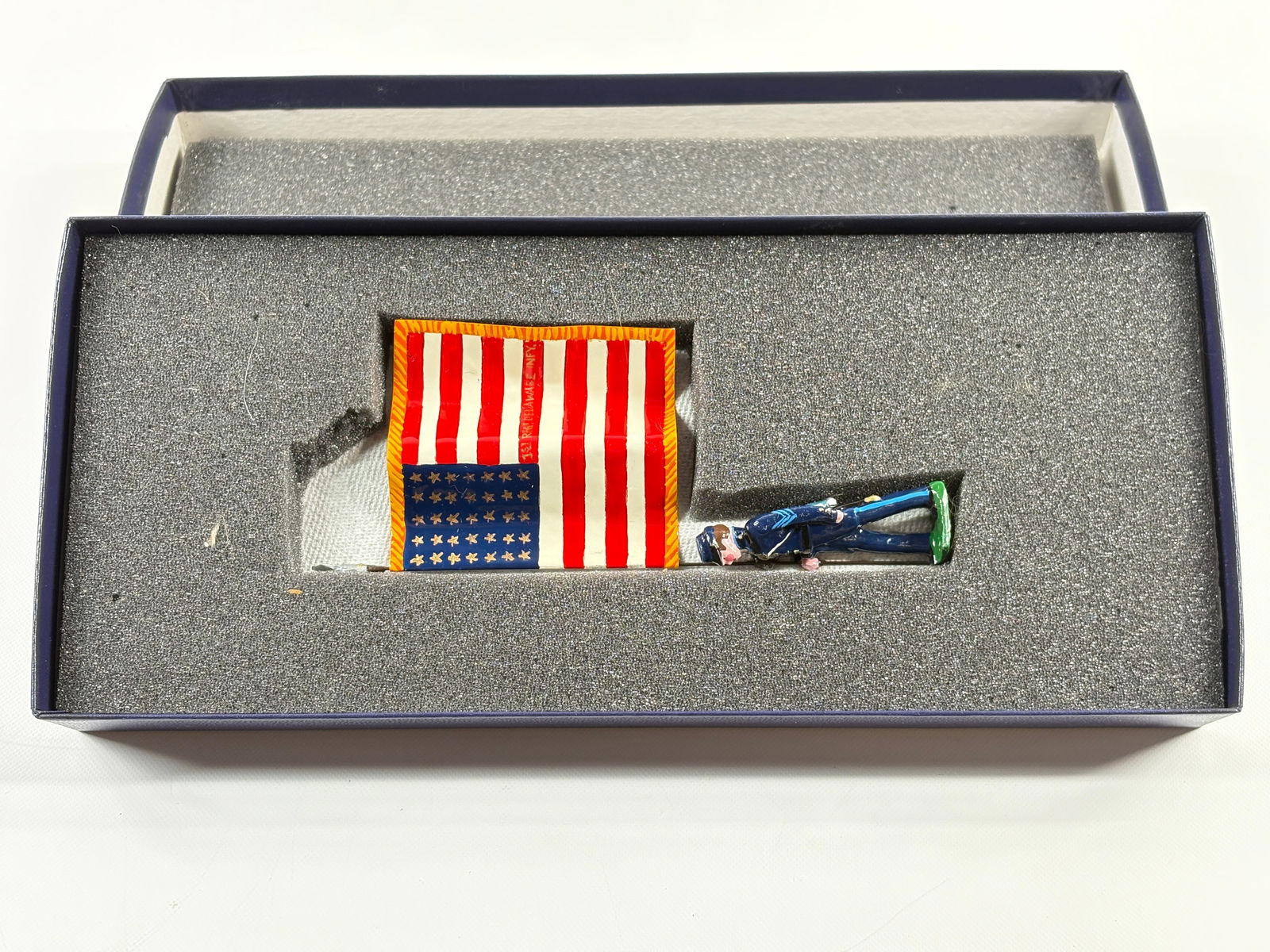 EDMUNDS 1ST DELAWARE VOLUNTEER MILITIA FLAG: REMAINS IN VERY GOOD CONDITION, SHOWING SOME WEAR FROM INSERT, NEED WIPED DOWN. BOX SHOWING SOME WEAR.