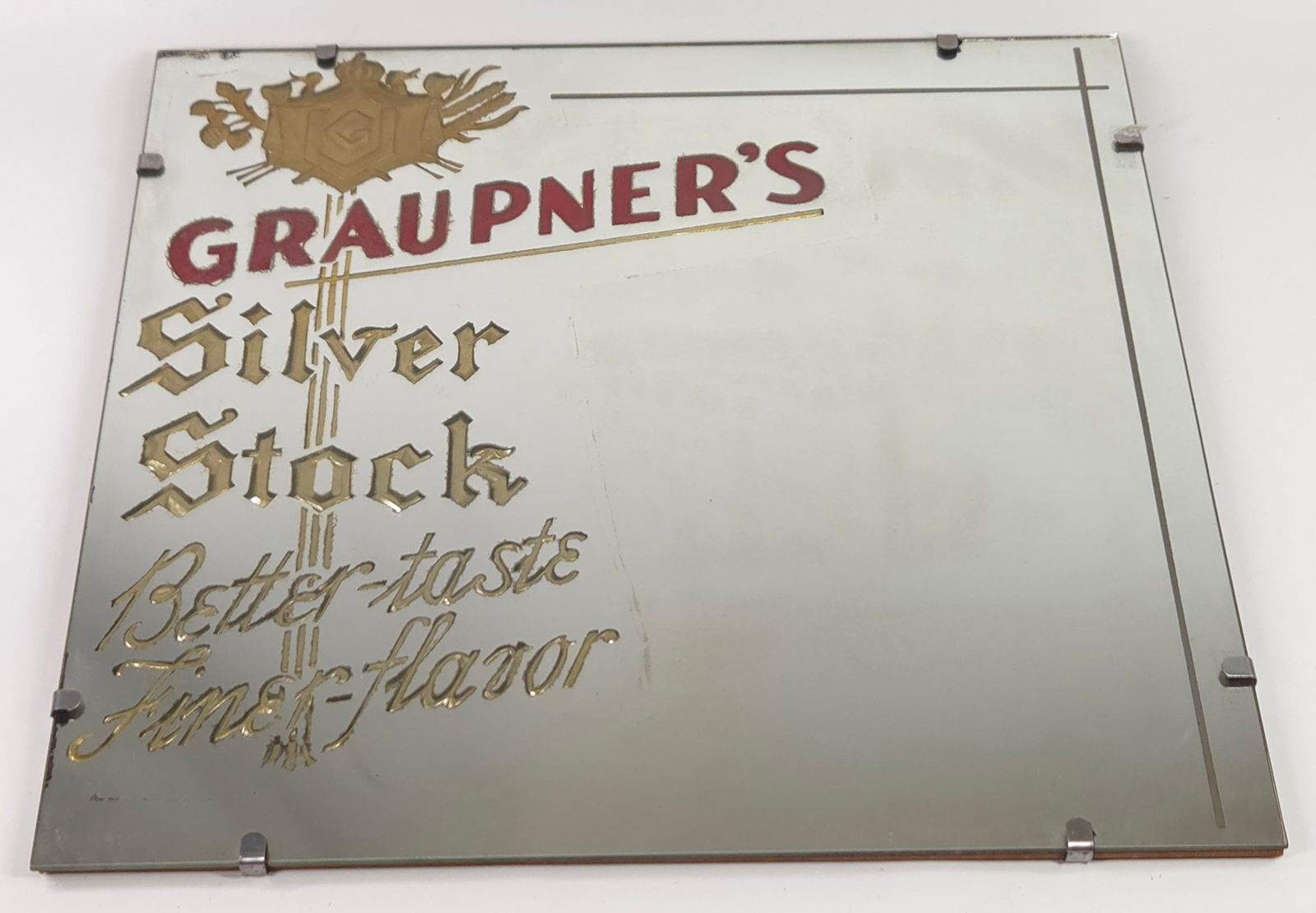GRAUPNER'S SILVER STOCK ADVERTISING MIRROR: REMAINS IN GOOD CONDITION, SHOWING SOME TYPICAL WEAR.