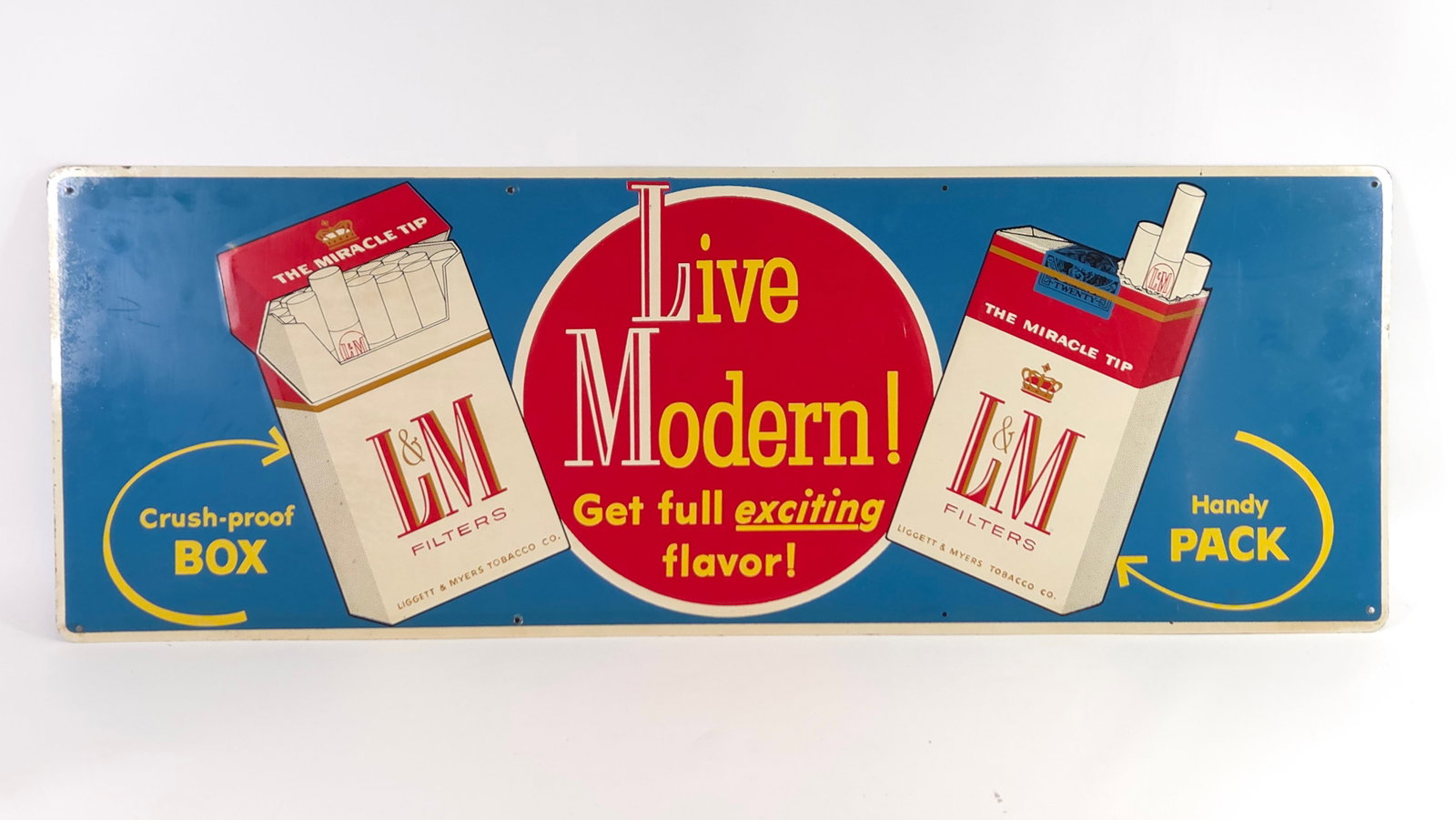 L&M CIGARETTES ADVERTISING SIGN: REMAINS IN GOOD CONDITION, SHOWING ONLY SOME TYPICAL WEAR ALONG EDGES.