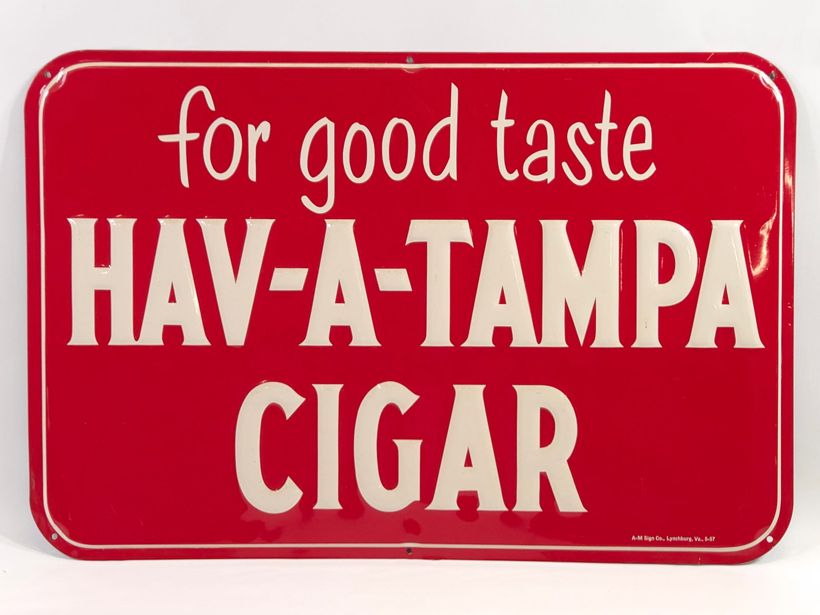 HAV-A-TAMPA CIGAR EMBOSSED ADVERTISING SIGN: REMAINS IN GOOD CONDITION, SHOWING ONLY SOME TYPICAL WEAR ALONG EDGES.