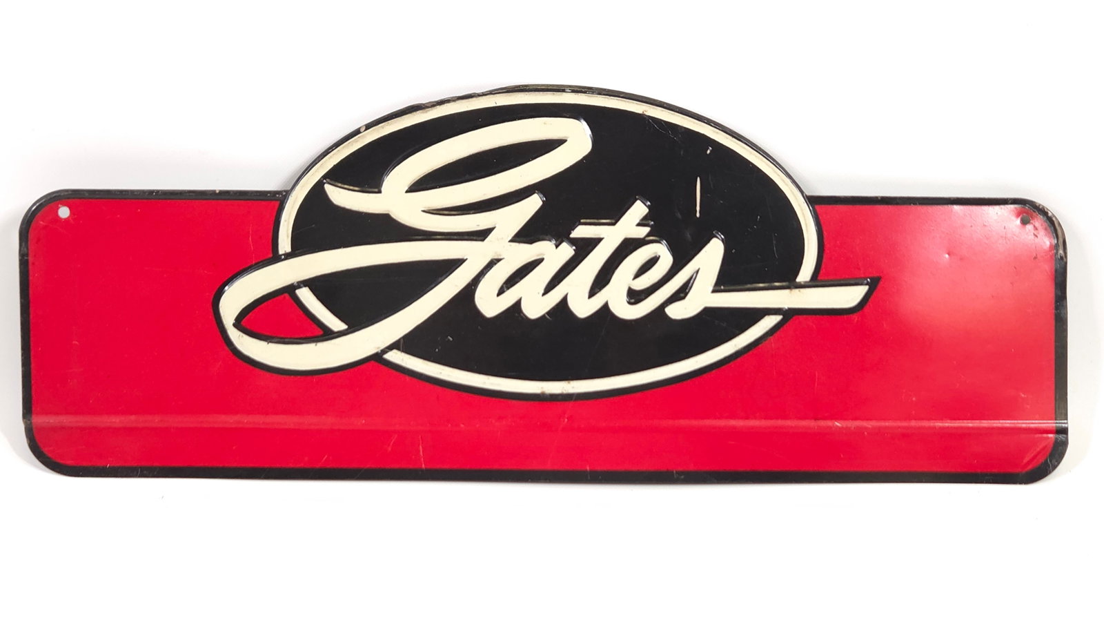 VINTAGE GATES ADVERTISING SIGN: REMAINS IN GOOD CONDITION, SHOWING SOME TYPICAL WEAR.