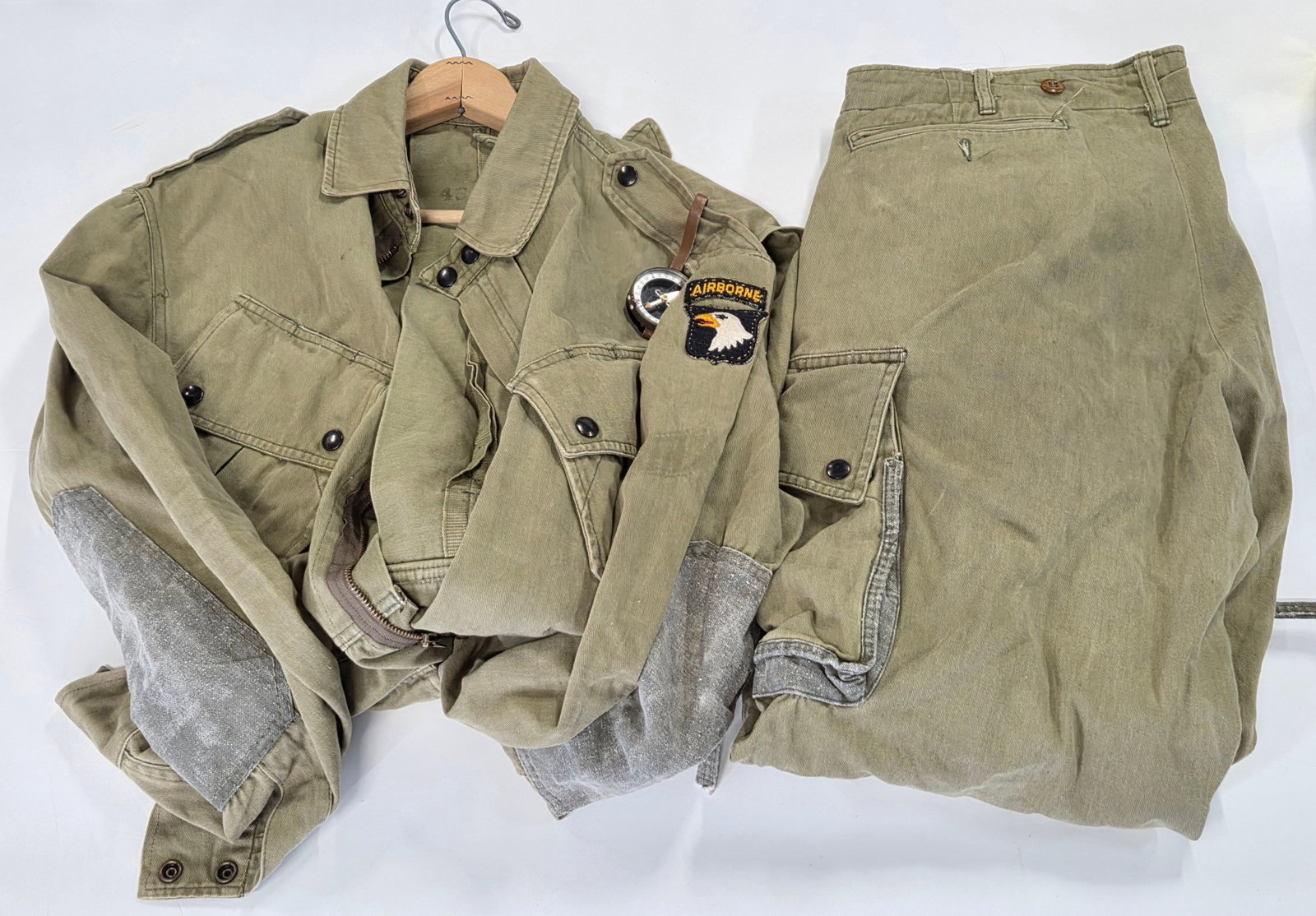 WWII US AIRBORNE UNIFORM W/ PATCH & COMPASS: REMAINS IN GOOD CONDITION, SHOWING SOME TYPICAL WEAR.