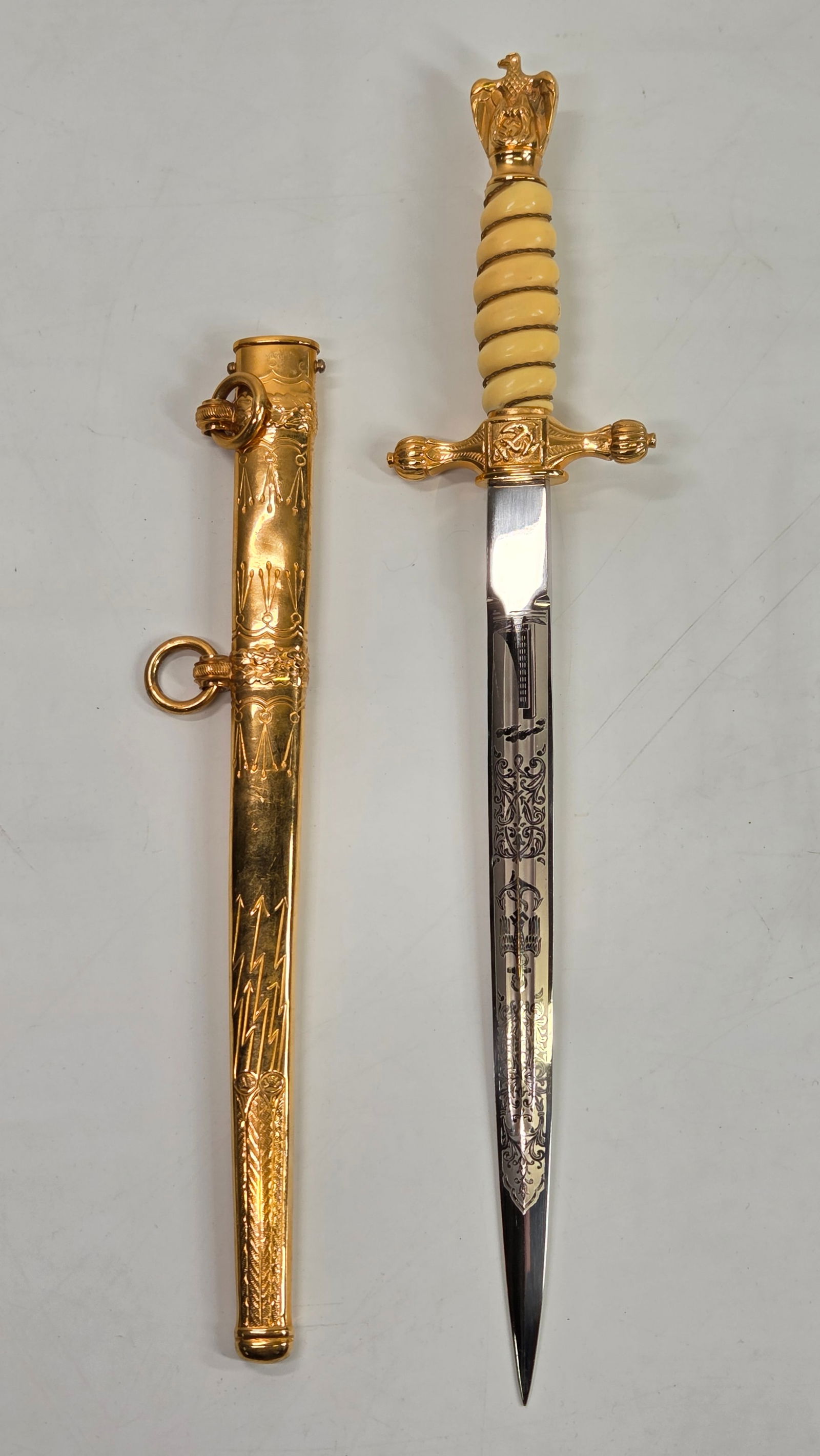 GERMAN WWII 2ND MODEL KRIEGSMARINE OFFICER'S DAGGER: REMAINS IN VERY GOOD CONDITION, SHOWING ONLY SOME MINIMAL STORAGE WEAR. BLADE ETCHED REMAINING VERY CLEAN. PAUL WEYERSBERG & CO. SOLINGEN.