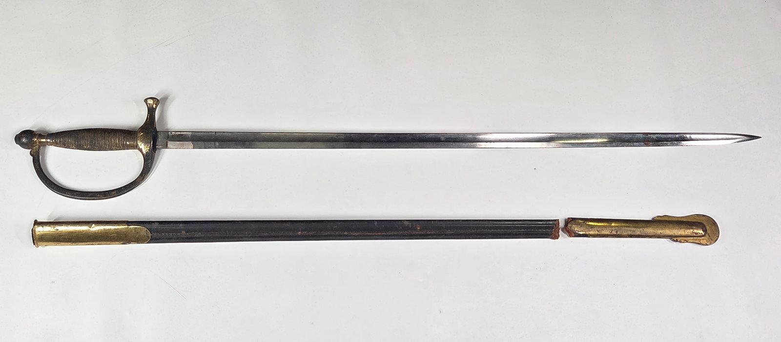 US MODEL 1849 NON COMMISSIONED OFFICER'S SWORD: REMAINS IN GOOD CONDITION, SHOWING SOME TYPICAL WEAR THROUGHOUT. SCABBARD SHOWING WEAR WITH LEATHER TORN IN HALF.