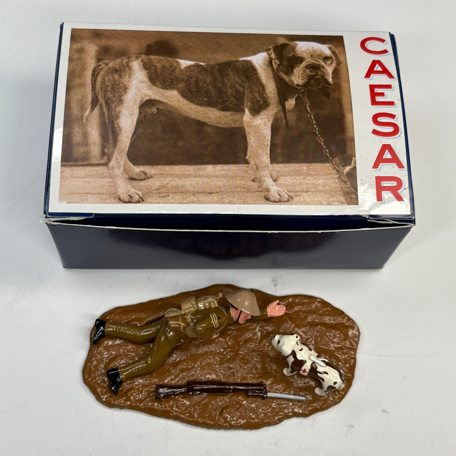 HAND PAINTED WWI CAESAR DOG & SOLDIER: REMAINS IN VERY GOOD CONDITION, SHOWING MINIMAL WEAR. BOXES REMAIN IN GOOD CONDITION, SHOWING SOME STORAGE WEAR.