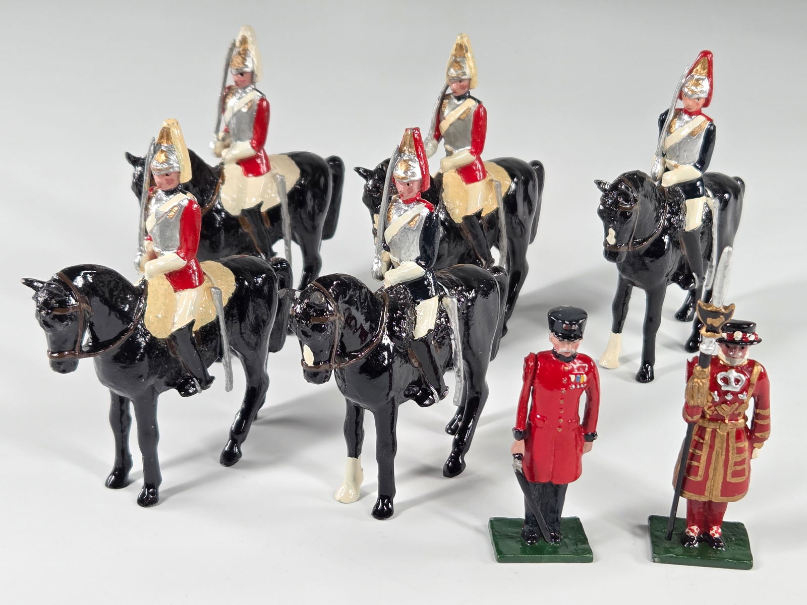 SET OF HAND PAINTED MOUNTED CAVALRY SOLDIERS: ALL REMAIN IN VERY GOOD CONDITION, SHOWING MINIMAL WEAR. BOXES REMAIN IN GOOD CONDITION, SHOWING SOME STORAGE WEAR.