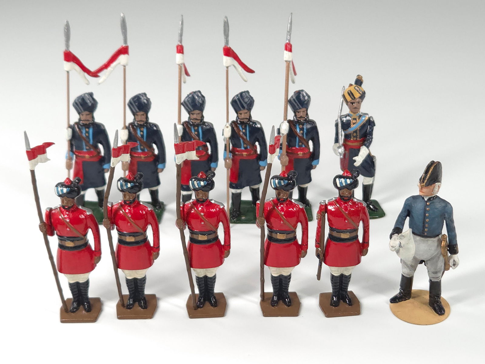 AYLMER OFFICER & 11) TRADITIONS SOLDIERS: ALL REMAIN IN GOOD CONDITION, SHOWING SOME MINIMAL WEAR. ONE WITH BEND IN STAFF AND ANOTHER WITH STAFF BROKEN.