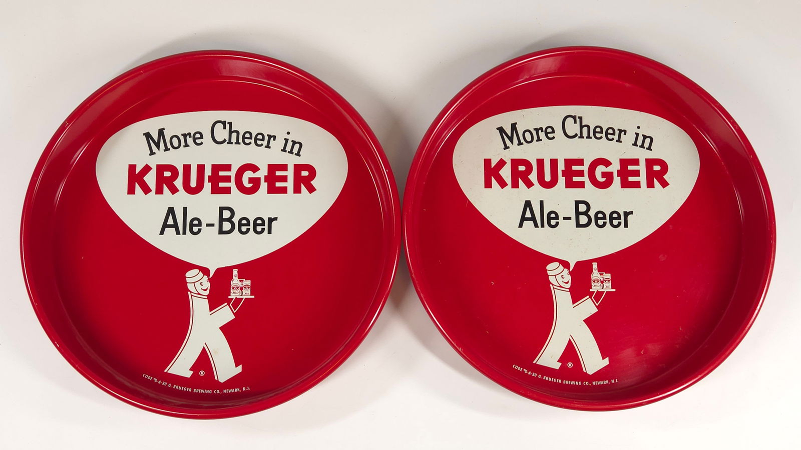 2) VINTAGE KRUEGER ALE-BEER ADVERTISING TRAYS: BOTH REMAIN IN GOOD CONDITION, SHOWING ONLY SOME MINIMAL WEAR.
