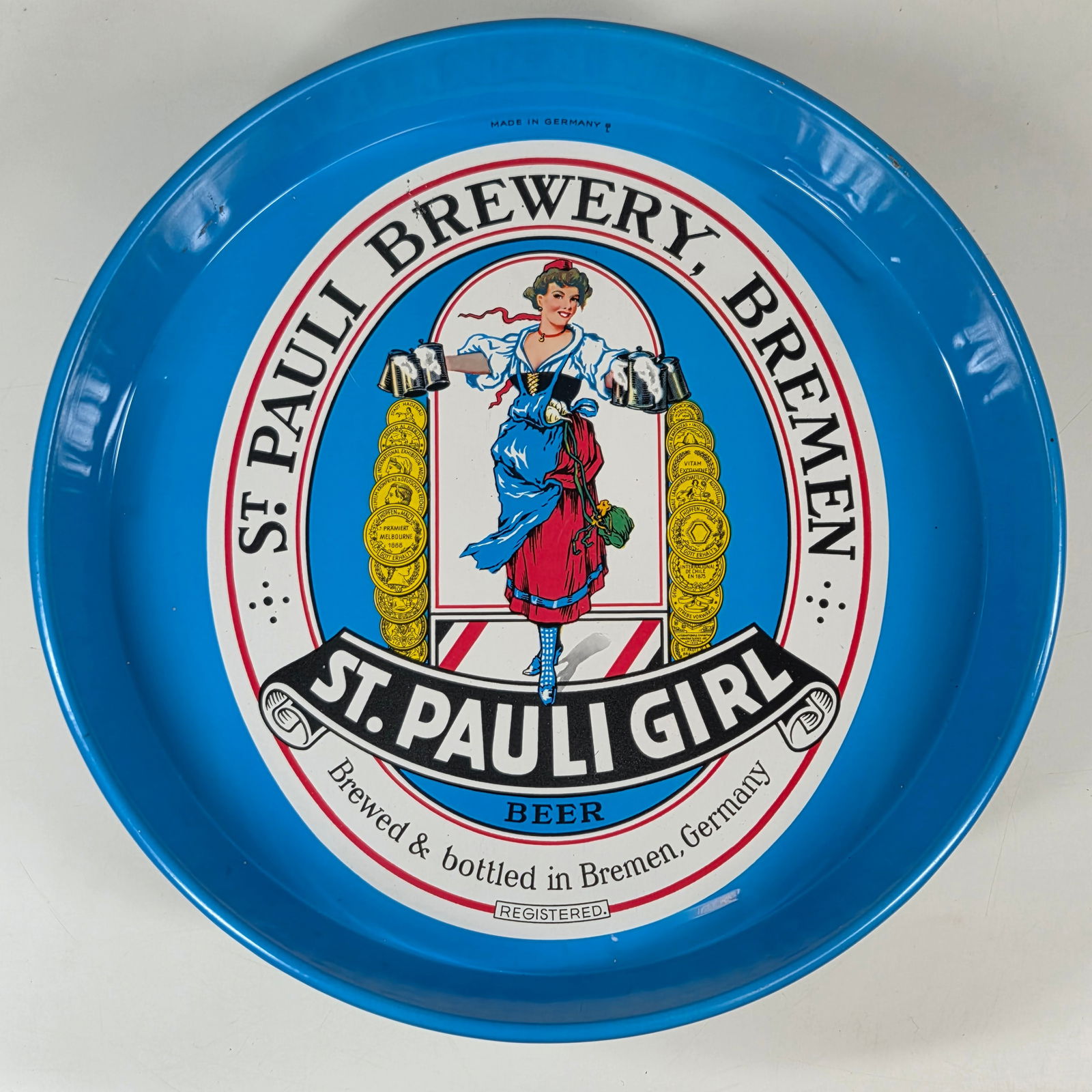 ST. PAULI GIRL ADVERTISING BEER TRAY: REMAINS IN GOOD CONDITION, SHOWING SOME TYPICAL WEAR.