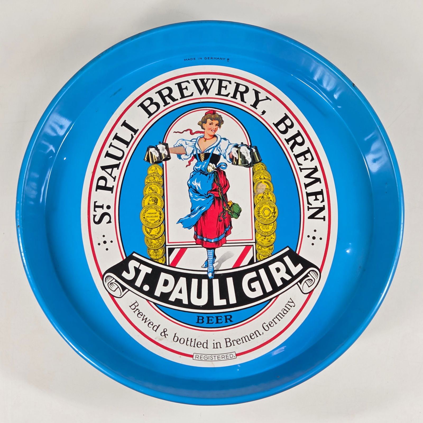 ST. PAULI GIRL ADVERTISING BEER TRAY: REMAINS IN GOOD CONDITION, SHOWING SOME TYPICAL WEAR.