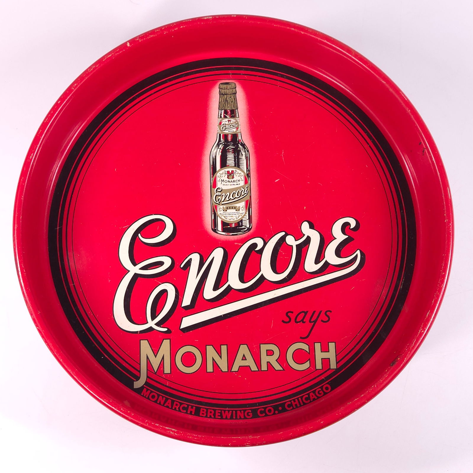 MONARCH BREWING CO. ENCORE ADVERTISING BEER TRAY: REMAINS IN GOOD CONDITION, SHOWING SOME TYPICAL WEAR.