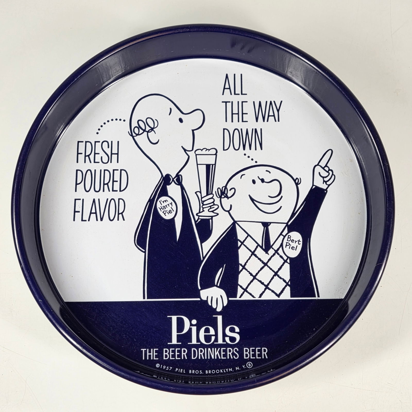 1957 PIEL'S LARRY & BERT ADVERTISING TRAY: REMAINS IN GOOD CONDITION, SHOWING SOME TYPICAL WEAR.