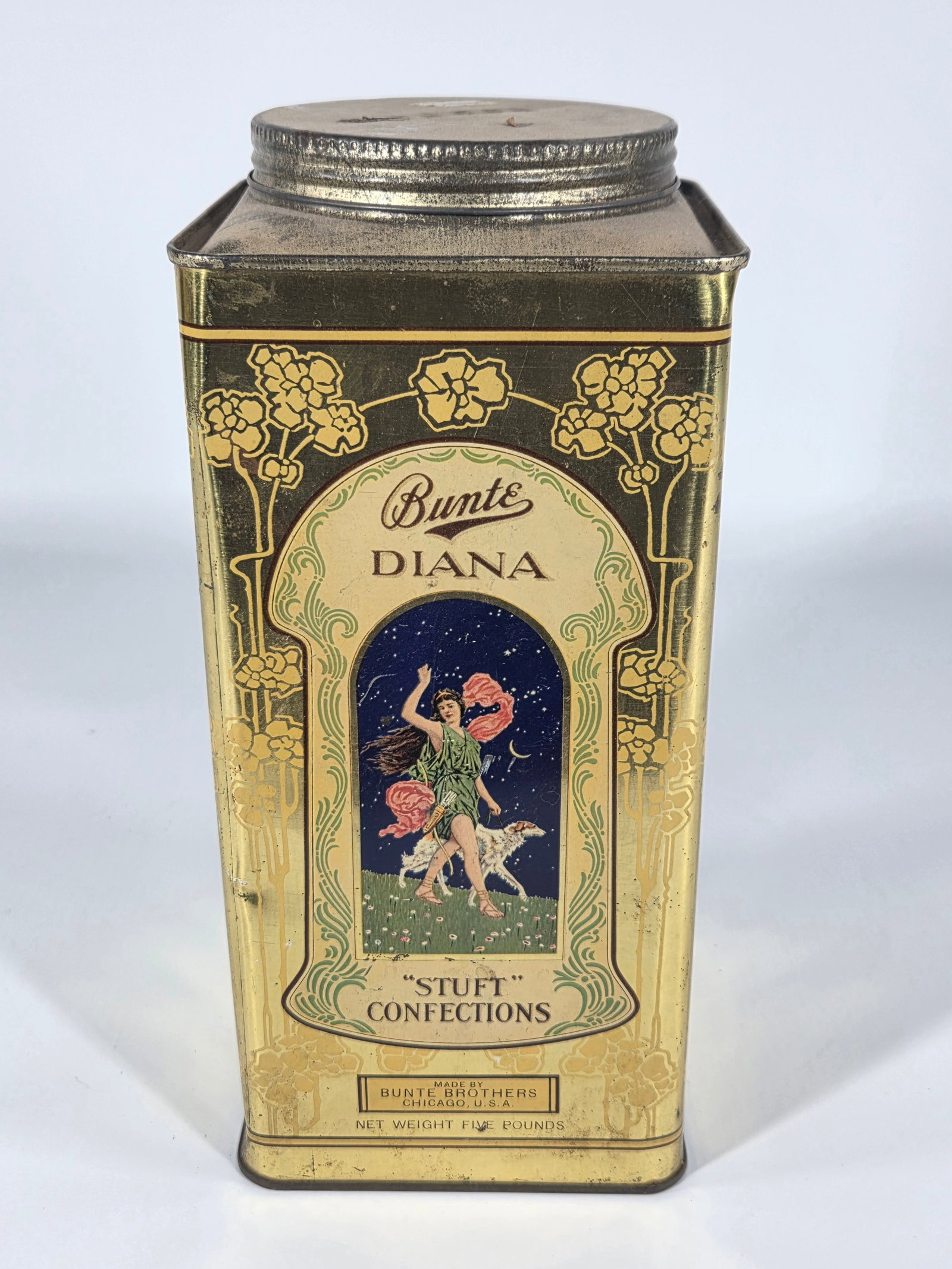 BUNTE BROTHERS DIANA STUFT CONFECTIONS TIN: REMAINS IN GOOD CONDITION, SHOWING SOME TYPICAL WEAR.