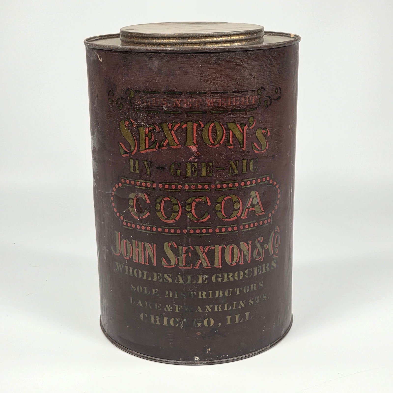 ANTIQUE JOHN SEXTON & CO. STENCILED COCOA TIN: REMAINS IN GOOD CONDITION, SHOWING SOME TYPICAL WEAR.