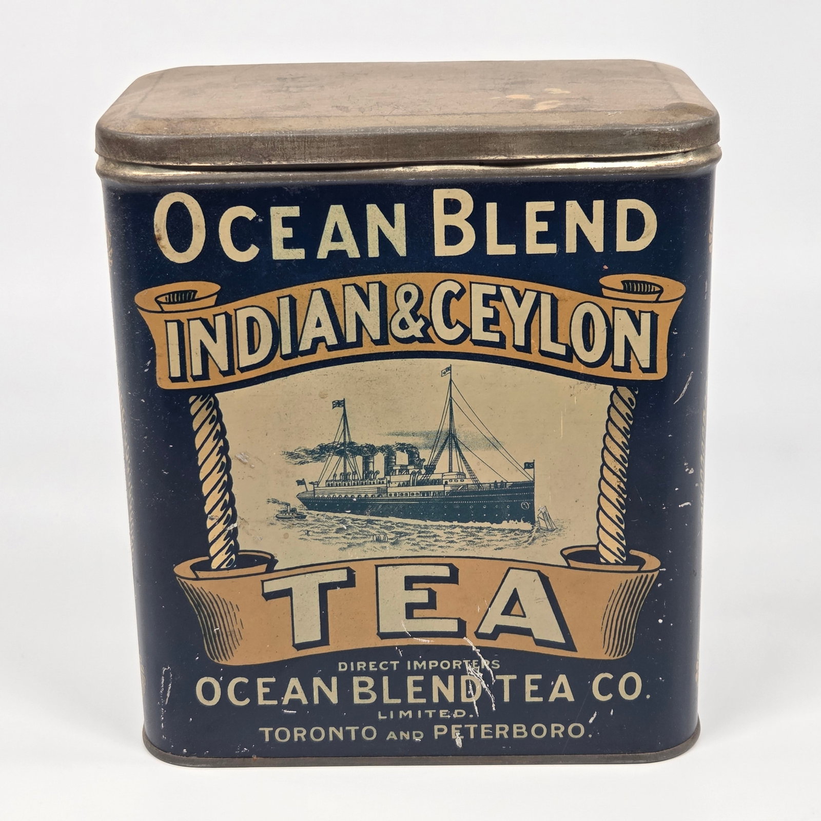 OCEAN BLEND TEA CO. INDIAN & CEYLON ADVERTISING TIN: REMAINS IN GOOD CONDITION, SHOWING SOME TYPICAL WEAR.
