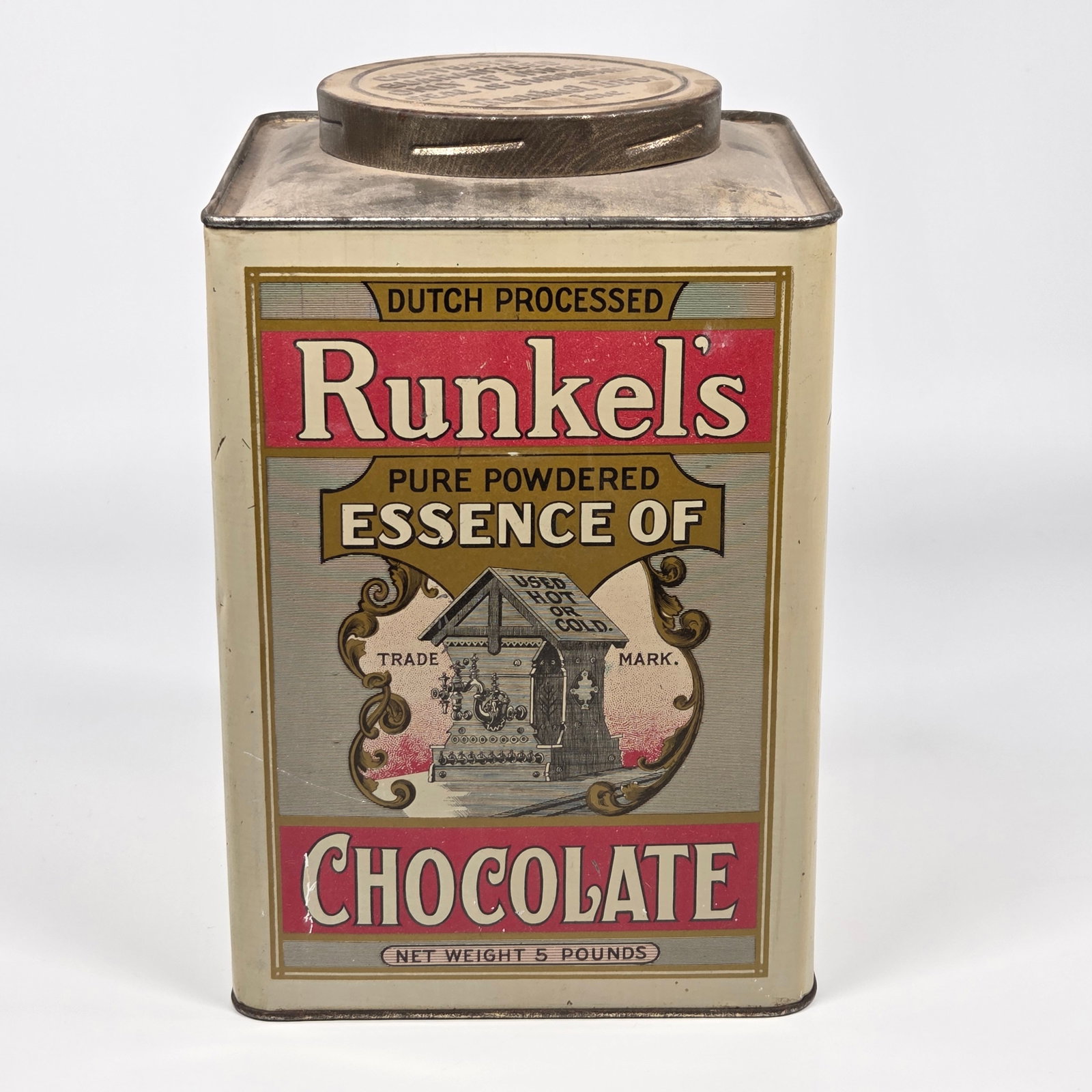 RUCKEL'S 5 POUND ADVERTISING CHOCOLATE TIN: SMALL DENT ALONG SIDE EDGE, OTHERWISE REMAINS IN GOOD CONDITION. SHOWING ONLY SOME TYPICAL WEAR.