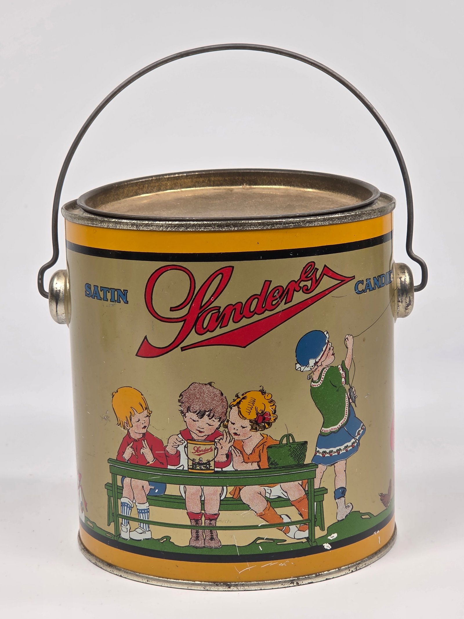 LANDERS SATIN CANDIES 2 1/2 POUND TIN W/ HANDLE: REMAINS IN GOOD CONDITION, SHOWING SOME TYPICAL WEAR.