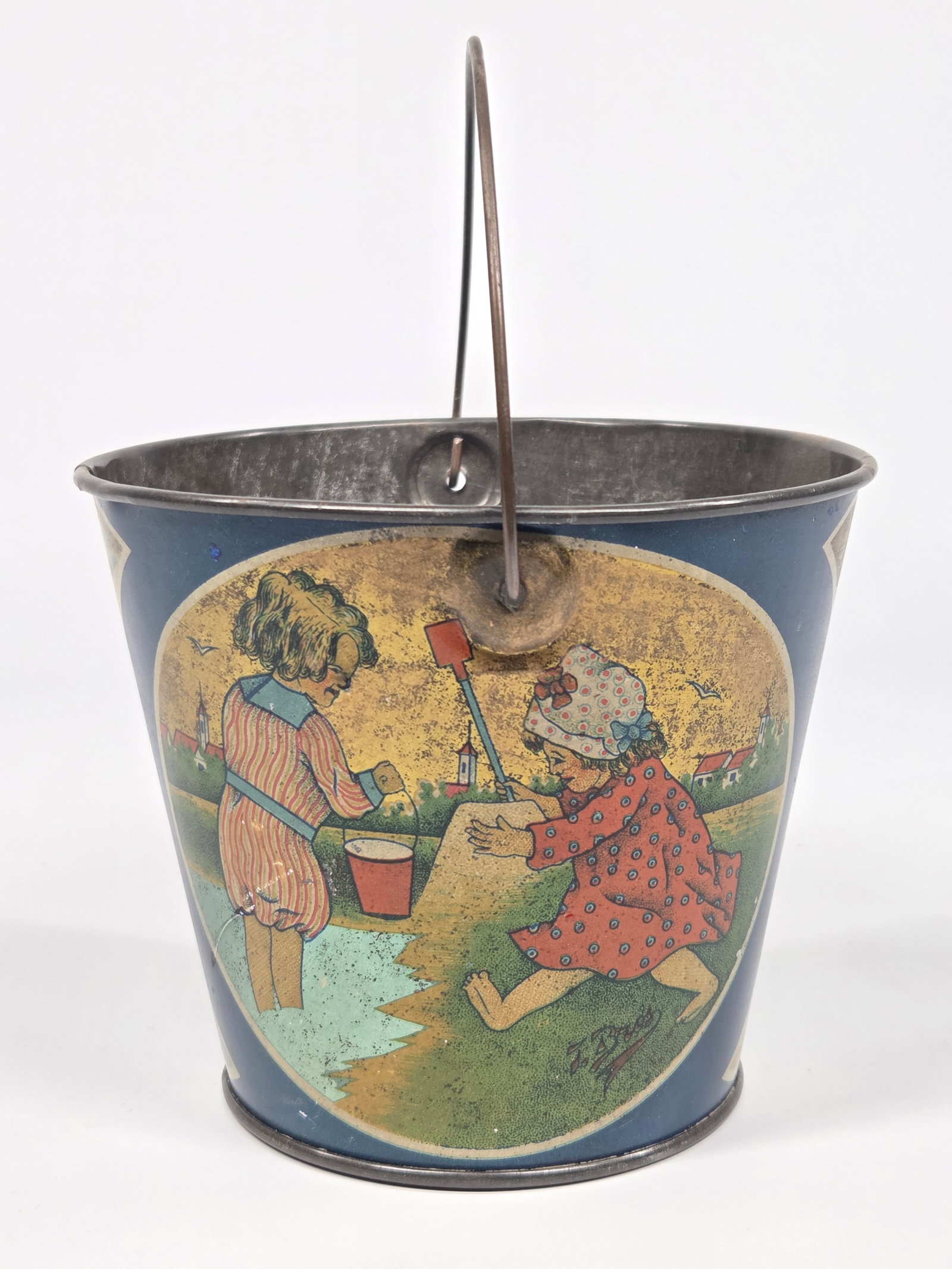 ANTIQUE CHILDS SAND TOY BUCKET W/ HANDLE: REMAINS IN GOOD CONDITION, SHOWING SOME TYPICAL WEAR.